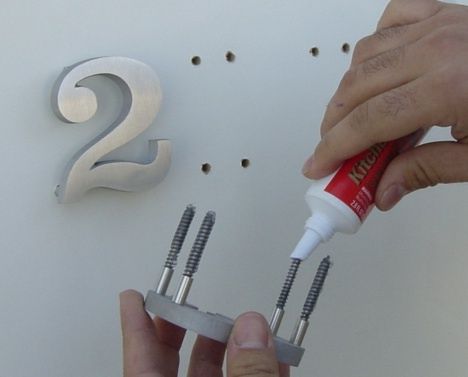 Step 3: Apply adhesive and mount house numbers